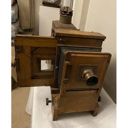 1199 - Thornton Pickard MCC No.6 oak projector with brass lens. 74cms l.