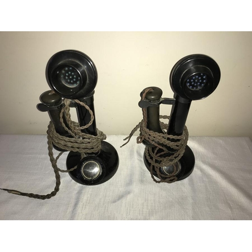 1200 - Two early 20thC Bakelite stick telephones . 31cms h.