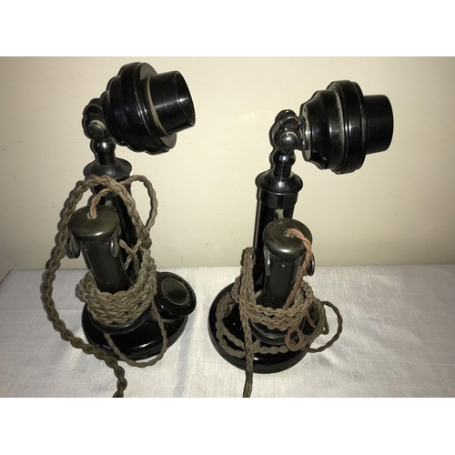 1200 - Two early 20thC Bakelite stick telephones . 31cms h.