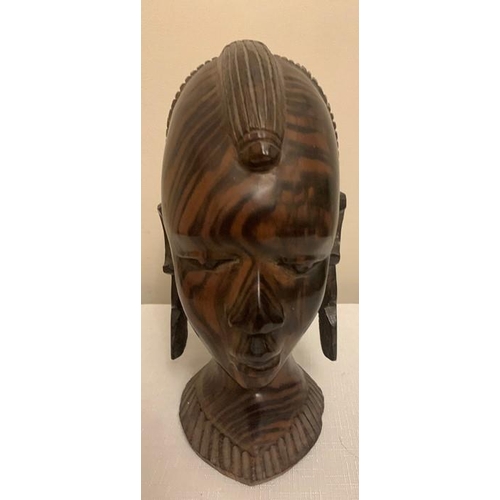 1233 - Nigerian hardwood female head. 26cms h.