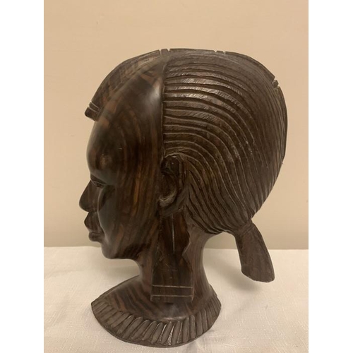 1233 - Nigerian hardwood female head. 26cms h.