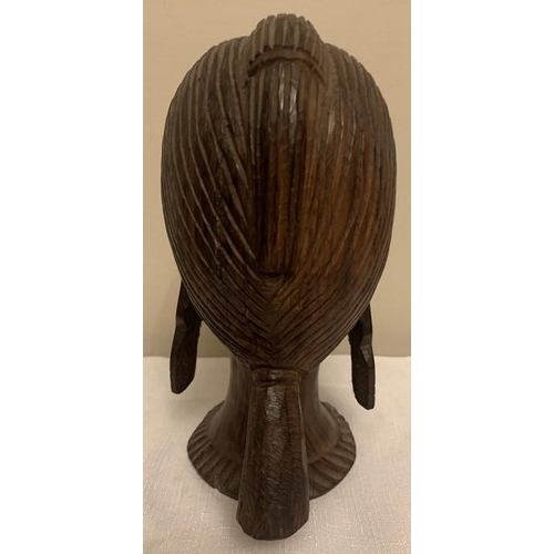 1233 - Nigerian hardwood female head. 26cms h.