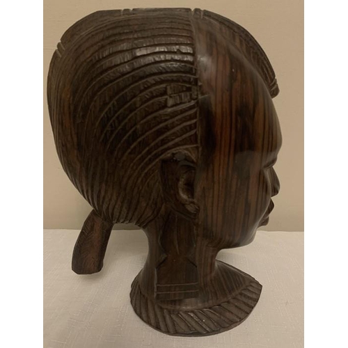 1233 - Nigerian hardwood female head. 26cms h.