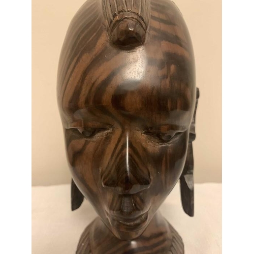 1233 - Nigerian hardwood female head. 26cms h.