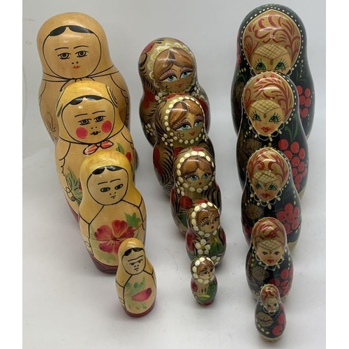 1235 - Three sets of hand painted Russian Babushka nesting dolls. Tallest 13cms.