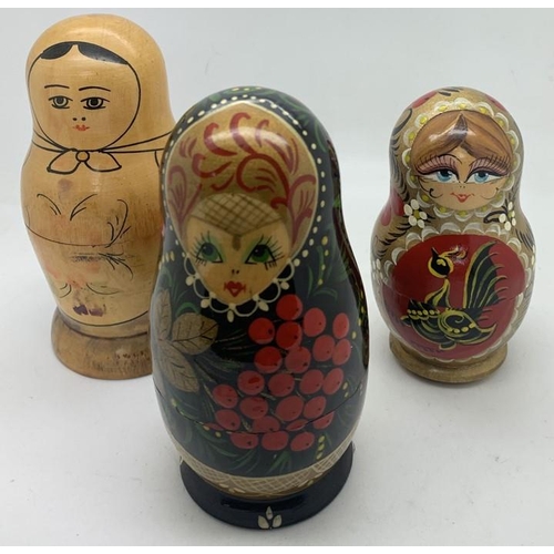 1235 - Three sets of hand painted Russian Babushka nesting dolls. Tallest 13cms.