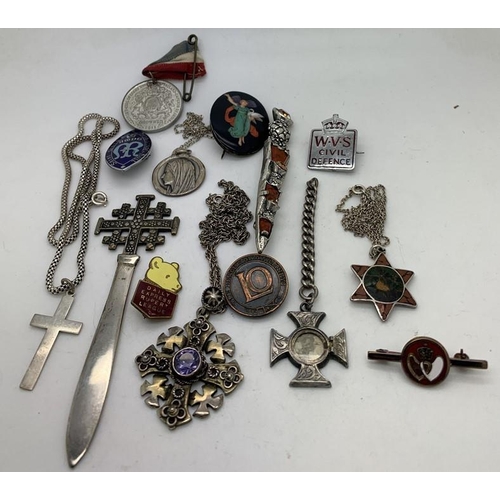 1239 - Jewellery and badges to include Jerusalem pendant marked 800 on chain, sterling silver crucifix, bad... 