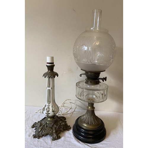 1273 - A 19thC brass and clear glass oil lamp with etched shade and back ceramic base together with a glass... 