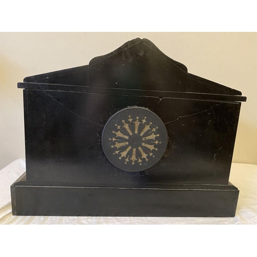 1278 - Black slate mantle clock with 6 Corinthian columns. Sounding on a gong, made in France. 42.5cms w x ... 