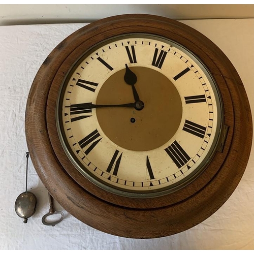 1285 - A 19thC wall clock, 30cms d, circular dial with Roman Numerals, total diameter 47cms with pendulum a... 