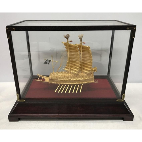 1296 - A 24ct gold plated Korean Turtle ship model in a glazed display case. Case measures 32 w x 19 d x 24... 