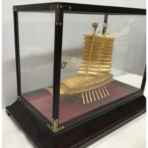 1296 - A 24ct gold plated Korean Turtle ship model in a glazed display case. Case measures 32 w x 19 d x 24... 