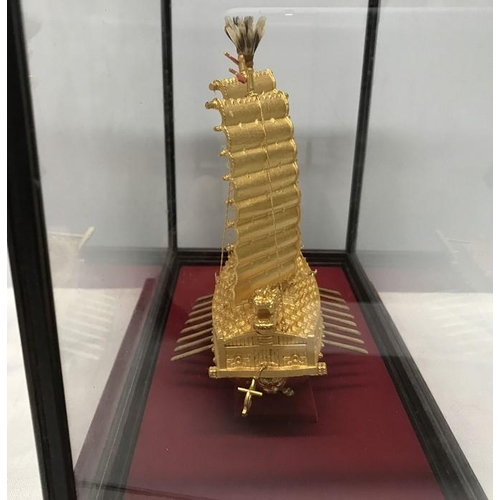 1296 - A 24ct gold plated Korean Turtle ship model in a glazed display case. Case measures 32 w x 19 d x 24... 