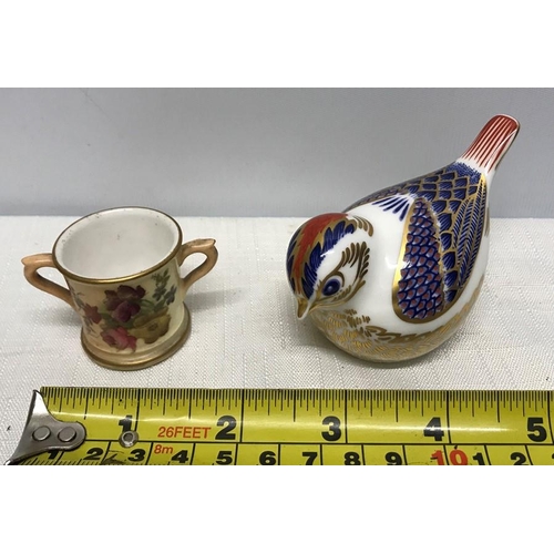 138 - Royal Crown Derby bird paperweight, 9.5cms l, silver stopper and a cup with floral painted decoratio... 