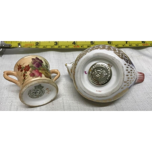 138 - Royal Crown Derby bird paperweight, 9.5cms l, silver stopper and a cup with floral painted decoratio... 