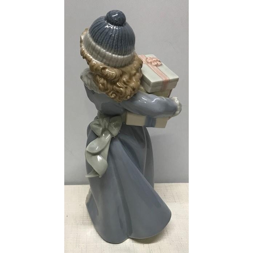 143 - Nao Lladro Daisa 1985, figurine girl with gift boxes, 23cms h.