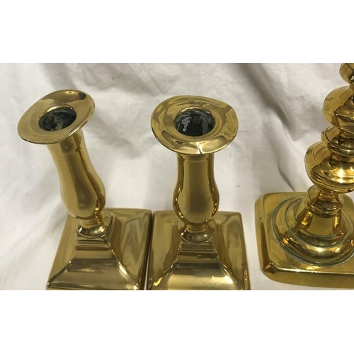 148 - Selection of brass candlesticks. Set of three 20cms h, a pair 15cms h and three singular candlestick... 