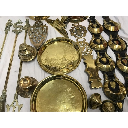 149 - Brassware, Horse brasses on leather strap, toasting forks, trivet, trays, jugs etc.