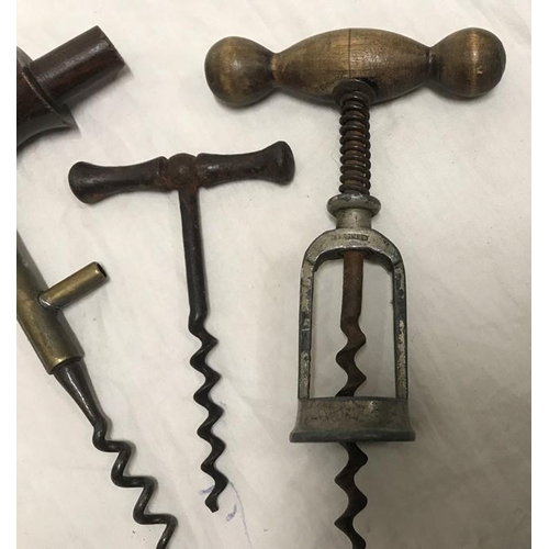 155 - Three assorted corkscrews, Hercules beech handled 15cms l, Coney's patent brass stem 16cms l and a s... 