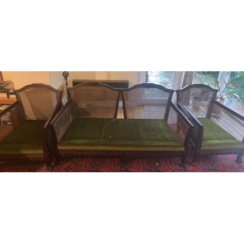 1590 - Three piece bergere cane suite. Two seater sofas and two armchairs. Chair 75d x 68w x 78hcm to back.... 