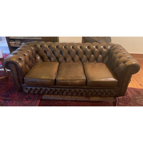 1591 - Brown leather button backed chesterfield sofa. 93d x 67h x 186w cm.