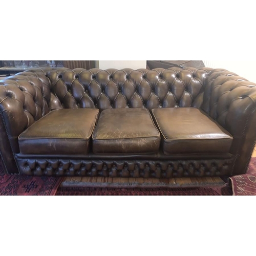 1591 - Brown leather button backed chesterfield sofa. 93d x 67h x 186w cm.