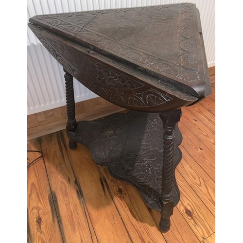 1593 - Carved oak drop leaf occasional table on three turned supports. Triangular in shape opening to a rou... 