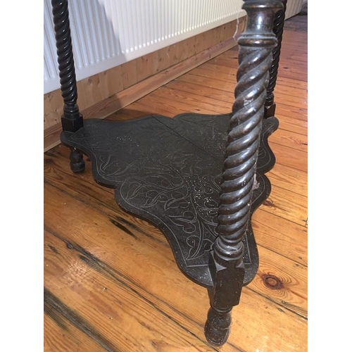 1593 - Carved oak drop leaf occasional table on three turned supports. Triangular in shape opening to a rou... 