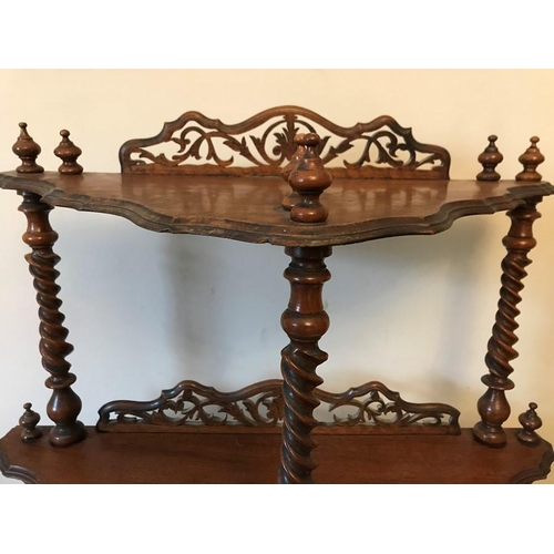 1596 - A Victorian mahogany watnot with barley twist supports and fretwork upstands. 58 h x 64 w x 36cms d.