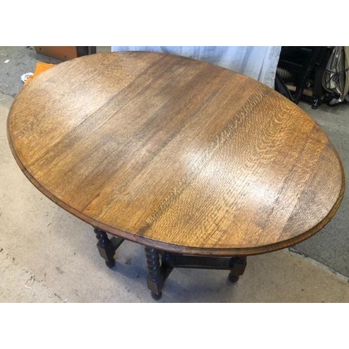 1601 - A barley sugar twist gateleg solid oak drop leaf table In good condition for age.106cm l x 76cm w x ... 