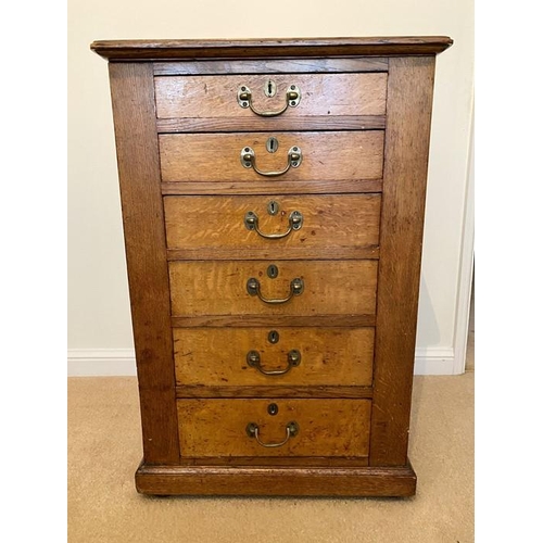 1604 - An oak 6 height chest of drawers.