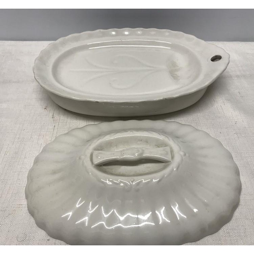 161 - A 19thC white pottery food warmer dish. 30cms w x 20cms x 9cms h.