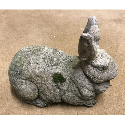 1632 - Reconstituted concrete garden ornament Rabbit 22cms h x 29cms l.