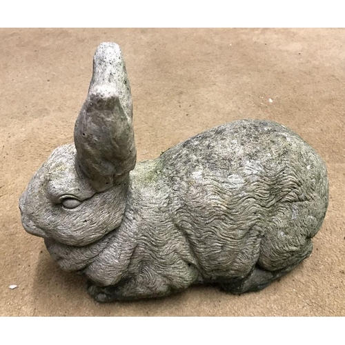 1632 - Reconstituted concrete garden ornament Rabbit 22cms h x 29cms l.