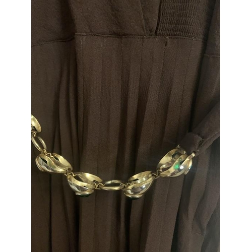 169 - A vintage 1940's brown crepe dress and underslip, labelled Princess frocks size 20, side zip, a gilt... 