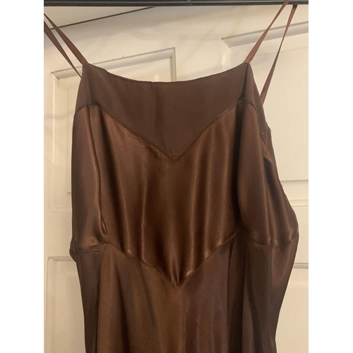 169 - A vintage 1940's brown crepe dress and underslip, labelled Princess frocks size 20, side zip, a gilt... 