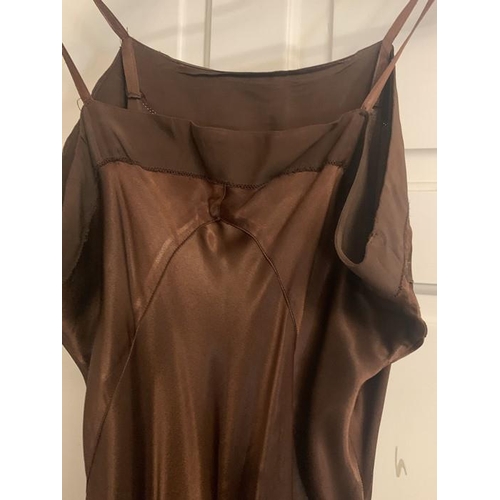 169 - A vintage 1940's brown crepe dress and underslip, labelled Princess frocks size 20, side zip, a gilt... 