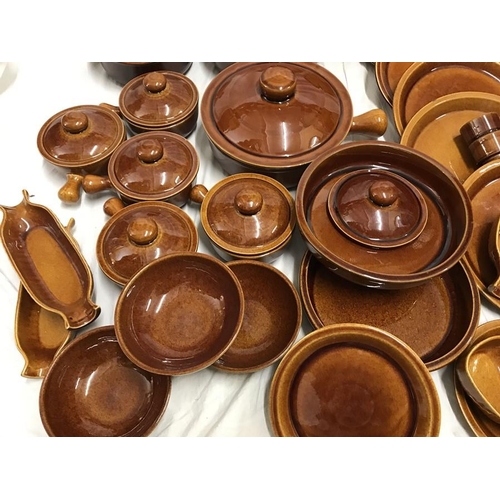 181 - Wattisfield ware, Suffolk, brown stoneware pottery dinner and cooking ware. 42 pieces. Tureens, dinn... 