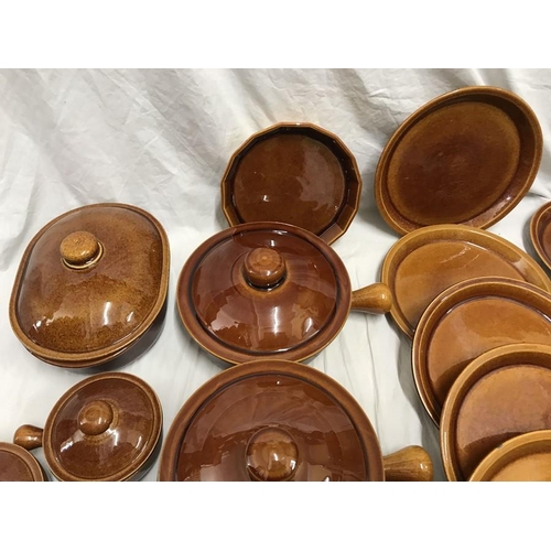 181 - Wattisfield ware, Suffolk, brown stoneware pottery dinner and cooking ware. 42 pieces. Tureens, dinn... 