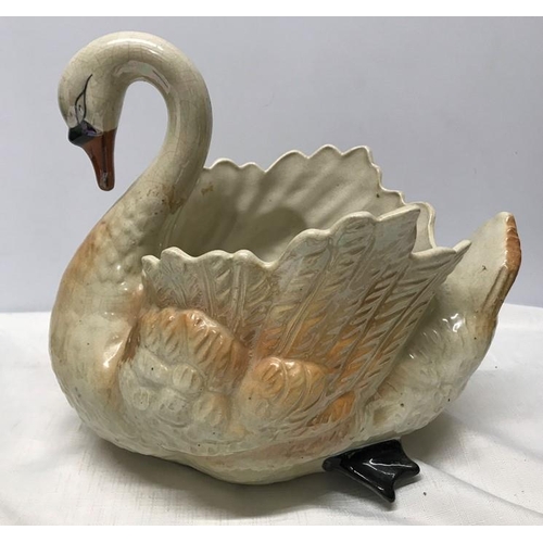 197 - Large pottery Swan jardiniere 30cms h, approx. length 34cms, approx. 24cms w.