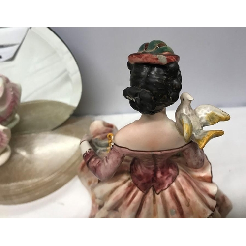 212 - Small Royal Doulton figurine, 17.5cms h stood on a half round onyx base with circular mirror back, o... 