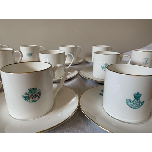 215 - Set of 14 fine bone china coffee cans and 16 saucers with light infantry emblems. Impamark Ltd.