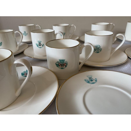 215 - Set of 14 fine bone china coffee cans and 16 saucers with light infantry emblems. Impamark Ltd.