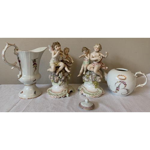 216 - Continental porcelain to include putti figurines, playing instruments, 20cms h, a teapot, jug and a ... 