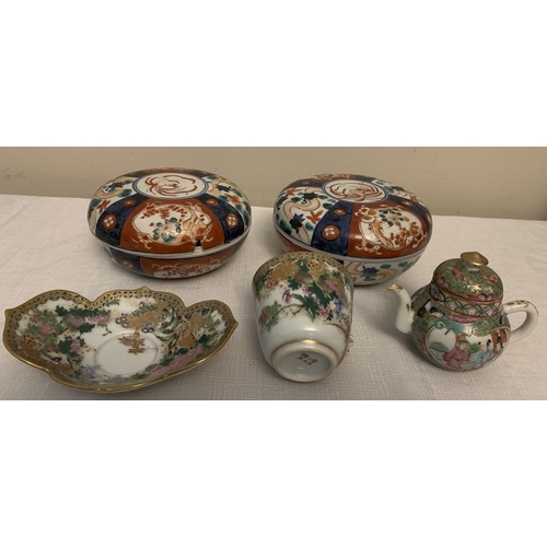 219 - Oriental ceramics to include two Japanese Imari lidded bowls, Satsuma cup and saucer with missing ha... 