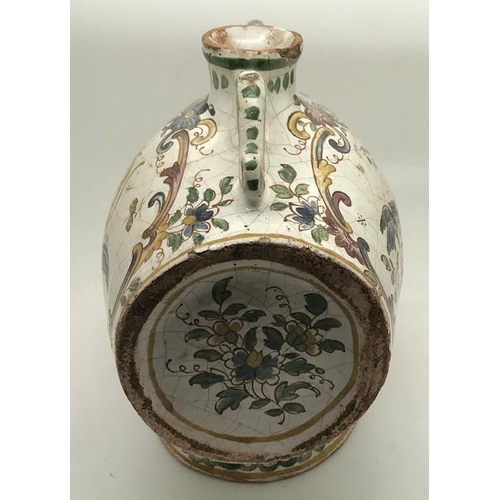 221 - A faience barrel shape spirit flask with polychrome decoration. Marked to the base with script F. 15... 