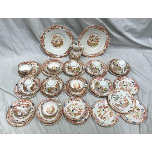 222 - A part tea service, 2 cake plates, jug, 11 cups, 12 saucers, 16 side plates, garden design. 1 bowl. ... 