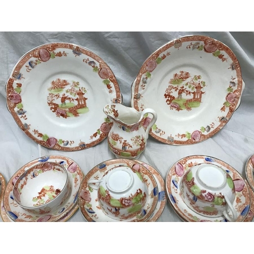 222 - A part tea service, 2 cake plates, jug, 11 cups, 12 saucers, 16 side plates, garden design. 1 bowl. ... 