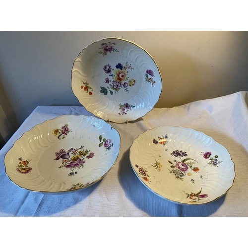 228 - Three 18thC Meissen dishes, two 28cms d, one at 25cms d decorated with floral sprigs.