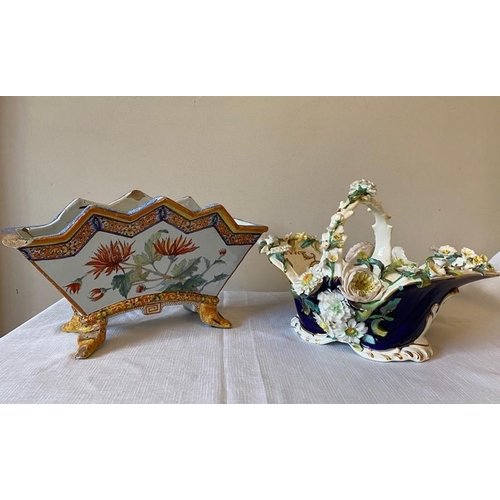 231 - A 19thC floral encrusted basket with a continental planter.